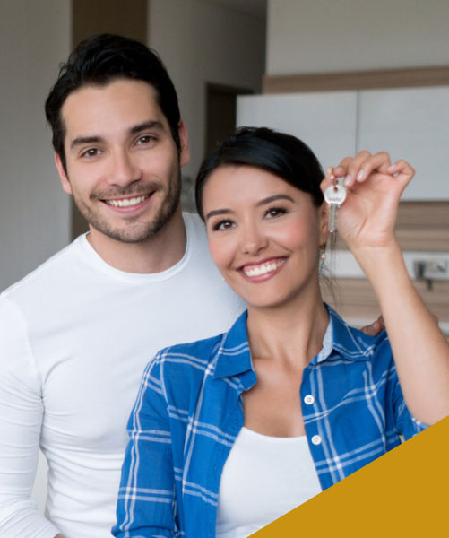 A couple holding new house keys